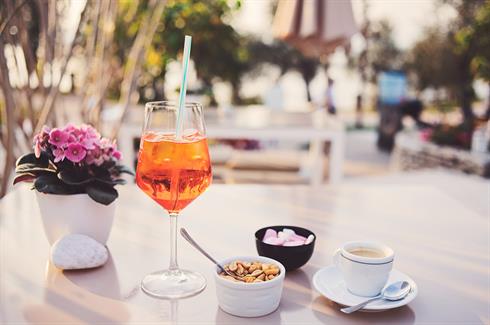 Wine Glass with Straw in it and Cup of Tea